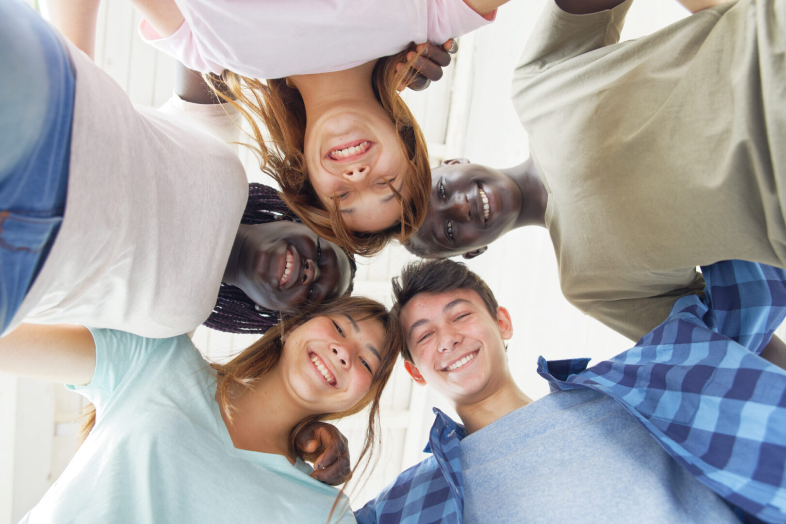 A group of people standing in the middle of their heads.